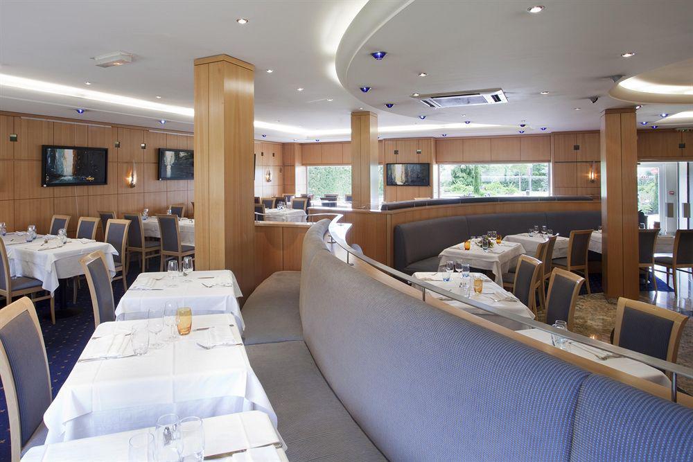 อพาร์ตโฮเต็ล อะดาจิโอ เจนีฟ ชองต์ เจนีส พัวอิลลี Aparthotel ธัวรี ร้านอาหาร รูปภาพ